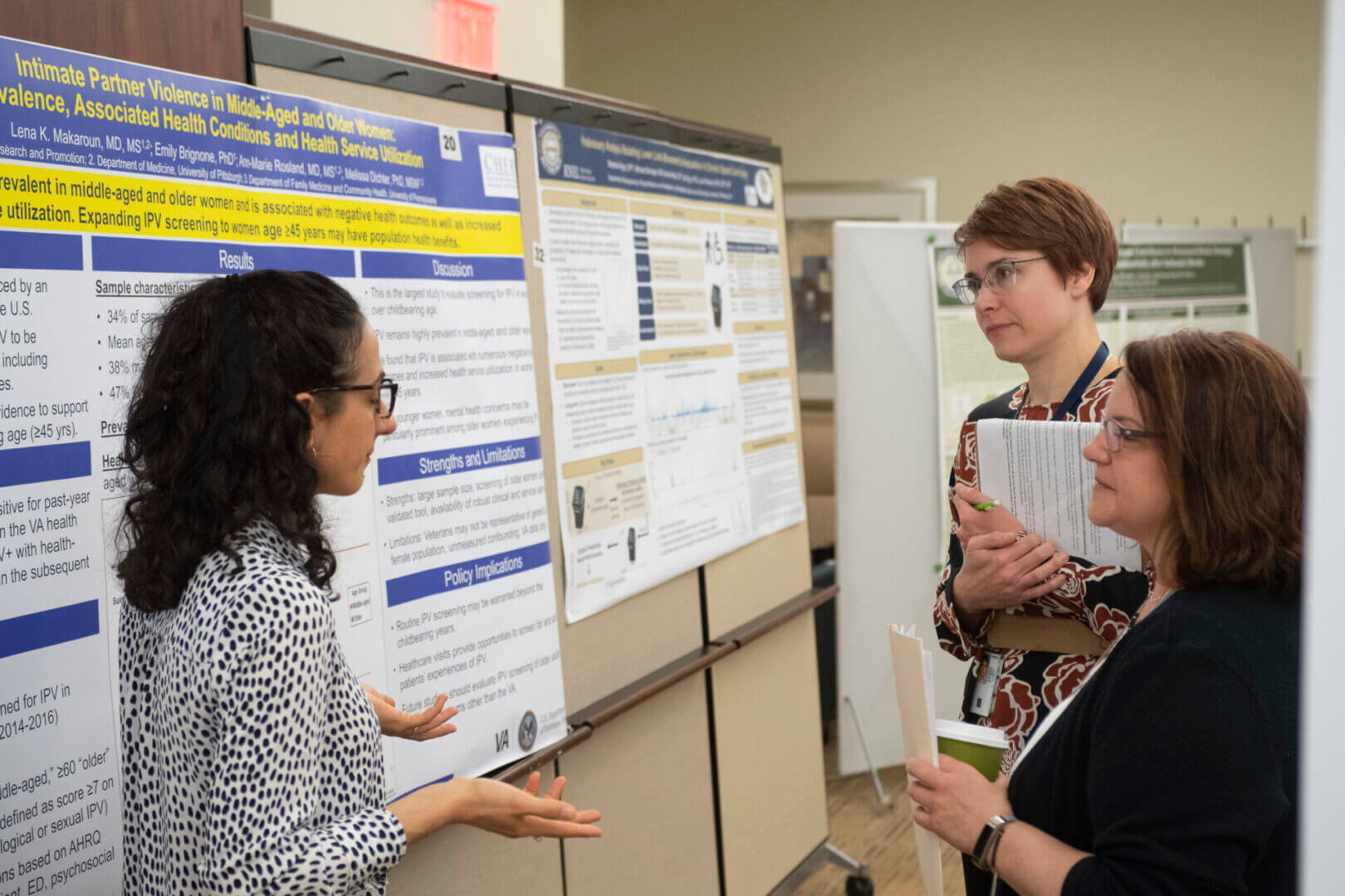 Academic presenting research poster at conference