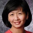 Smiling woman portrait with gray background