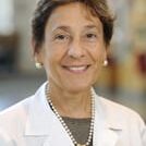 Portrait of smiling female doctor in white coat