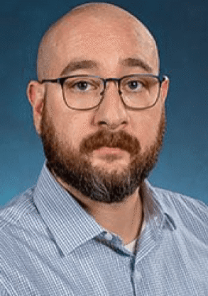 Bald man with glasses and beard.
