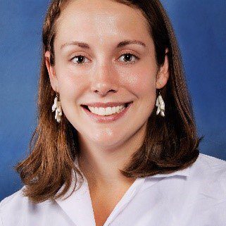 Smiling medical professional in white coat