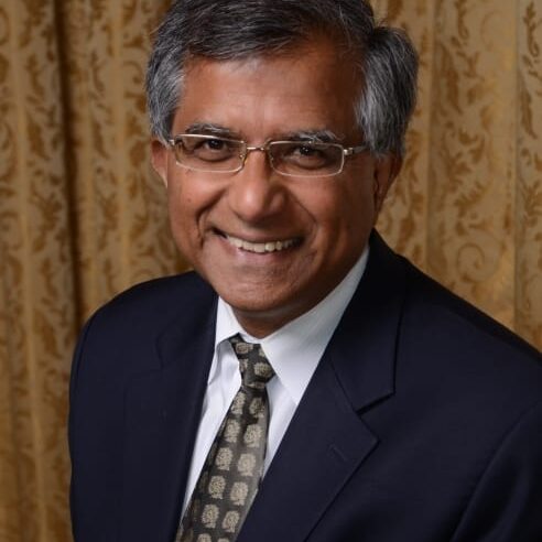 Smiling middle-aged man in suit and tie
